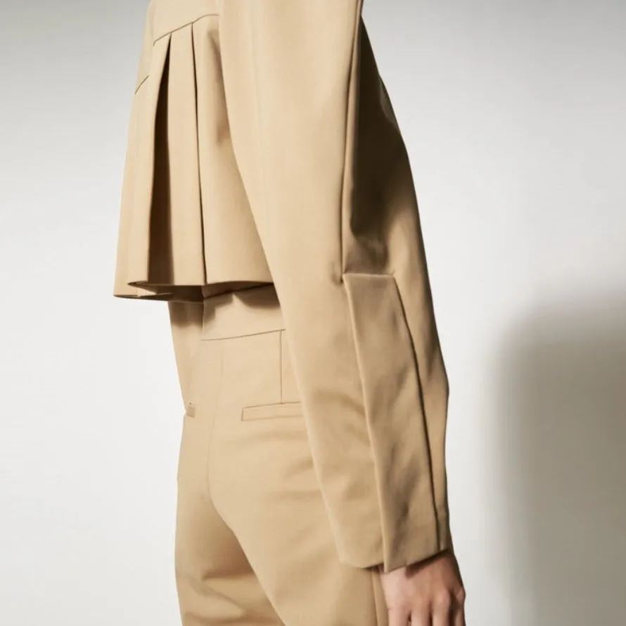 Beige structure signature pleated crop jacket